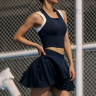Navy halter pickleball top with built in bra and matching pleated skirt figure flattering fit