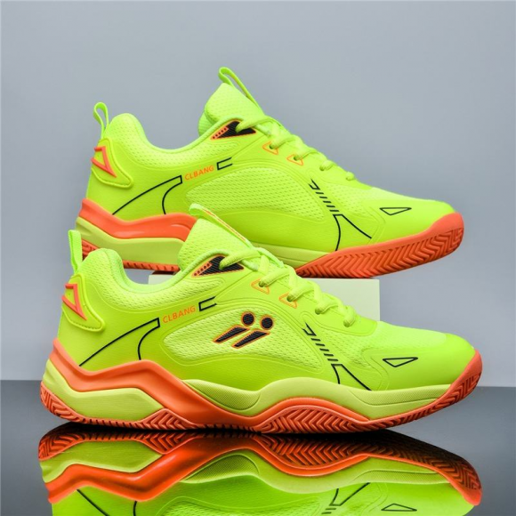 Unisex pickleball tennis training shoes in green with breathable seamless mesh upper and orange rubber outsole