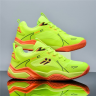 Unisex pickleball tennis training shoes in green with breathable seamless mesh upper and orange rubber outsole